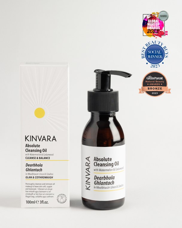 Absolute Cleansing Oil in a pump bottle beside its carton, with award badges